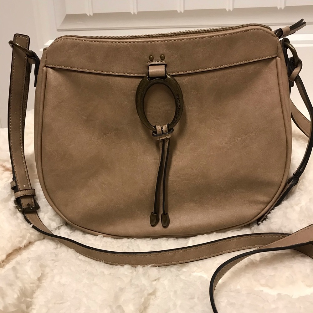 Large taupe colored crossbody bag.